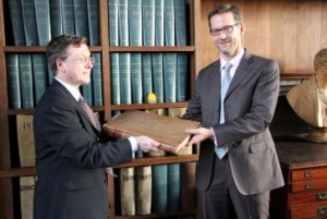Richard Heaton presents Giles Mandelbrote with a rare Book of Common Prayer