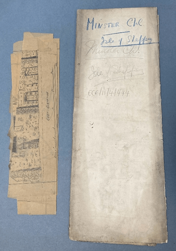 Two stacks of creased paper on the left is a cream coloured folded plan and on the left a smaller stack of folded tracing paper pages.