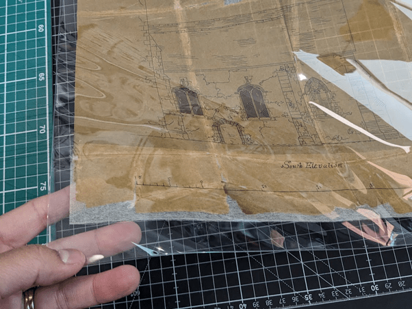 Tracing paper with drawings inside a Melinex sleeve