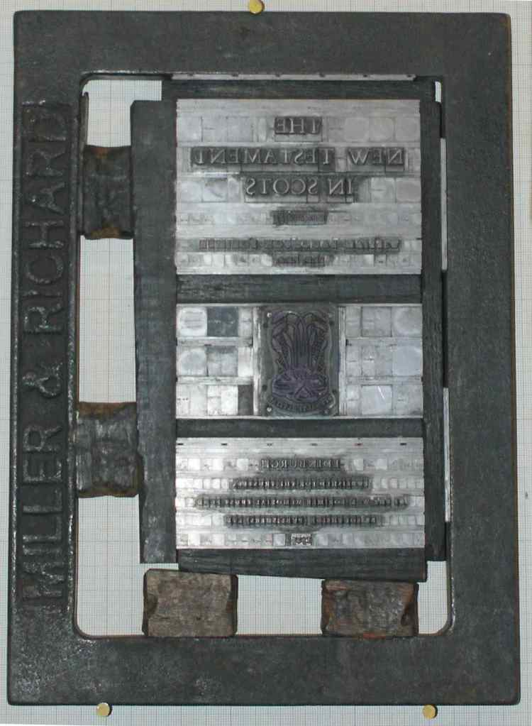 A forme with movable type.